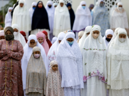 Thousand of Indonesian Muslims hold Eid al-Adha prayers amid the COVID-19 pandemic at Baiturrahman Grand Mosque, Banda Aceh, Indonesia