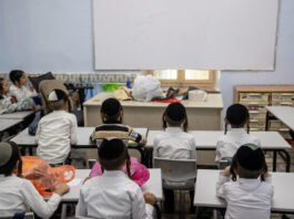 Photo by Yonatan Sindel/Flash90 clicked on August 9, 2021 shows students at an ultra-Orthodox school in Jerusalem