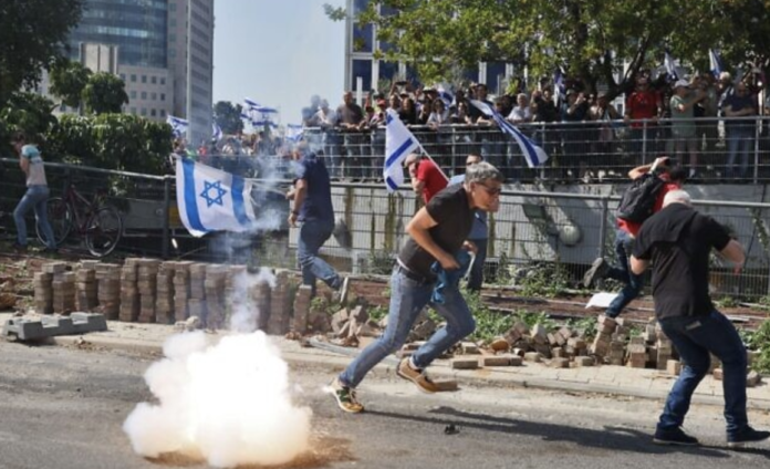 Officials questioned for throwing stun grenades at protestors