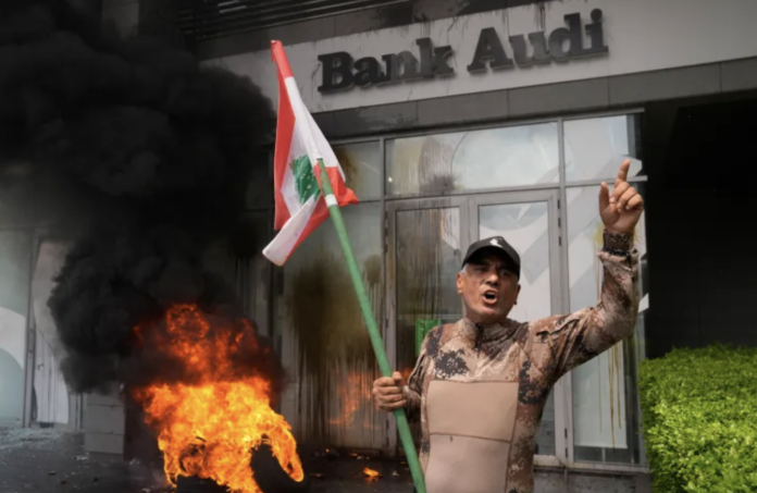 Protesters in Lebanon took to the streets on Thursday, expressing their frustration and anger by attacking bank buildings, setting tires ablaze, and smashing windows Protesters in Lebanon took to the streets on Thursday, expressing their frustration and anger by attacking bank buildings, setting tires ablaze, and smashing windows