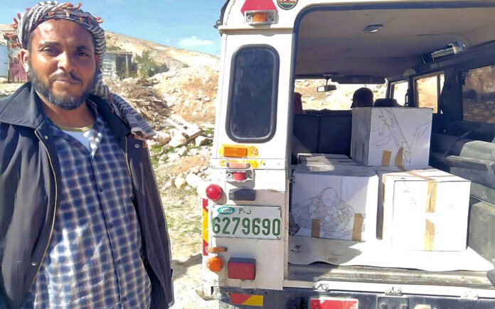 Amidst the backdrop of escalating conflict, Kamen and dozens of other Israelis are volunteering their time and resources to pack and deliver boxes of food as part of the 