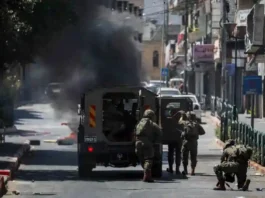The assailant, armed with a handgun, arrived at the bypass route in the Yehuda Brigade area. Upon arrival, he opened fire on an Israeli civilian before exiting his vehicle and stabbing the victim
