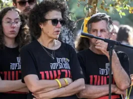 Esther (C), mother of deceased hostage Yagev Buchshtav, speaks during his funeral in Kibbutz Nirim in southern Israel on August 21, 2024. (Gil Cohen-Magen/AFP)
