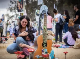 Friends and family of the victims of the Nova music festival massacre gather at the site of the massacre in southern Israel one year after the brutal assault, October 7, 2024. (Yonatan Sindel/Flash90)