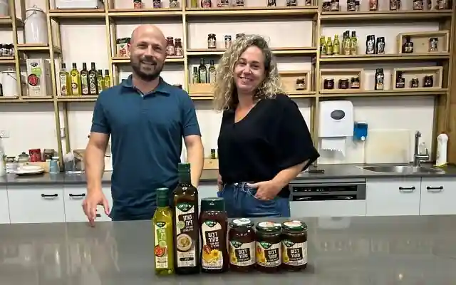 Oriana Tubul (R), CEO of the Yad Mordechai honey and olive oil processing factory, and Ido Dvir, the company’s manager of agricultural raw materials, at Kibbutz Yad Mordechai, southern Israel, September 1, 2024. (Sue Surkes/Times of Israel) Oriana Tubul (R), CEO of the Yad Mordechai honey and olive oil processing factory, and Ido Dvir, the company’s manager of agricultural raw materials, at Kibbutz Yad Mordechai, southern Israel, September 1, 2024. (Sue Surkes/Times of Israel)