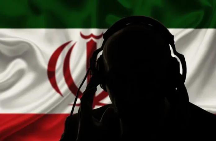 The silhouette of a man, seen over the flag of the Islamic Republic of Iran (illustrative) (credit: SHUTTERSTOCK)