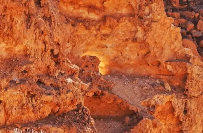 The phenomenon occurs during a few days in December, when sunlight reflects on the edges of a cave aperture on the mountain, creating an effect resembling fire The phenomenon occurs during a few days in December, when sunlight reflects on the edges of a cave aperture on the mountain, creating an effect resembling fire