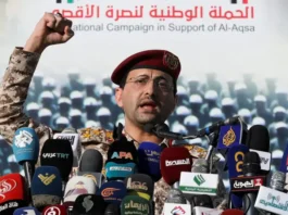 Houthi military spokesman, Yahya Sarea, delivers a statement claiming attacks on Israel, during a rally by protesters, mainly Houthi supporters, to show support to Palestinians in the Gaza Strip, in Sanaa, Yemen December 20, 2024. (credit: REUTERS/KHALED ABDULLAH)