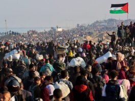 By 7 a.m., crowds of people, many carrying their belongings on foot, flooded the coastal highway stretching from the southern parts of the Gaza Strip to the north
