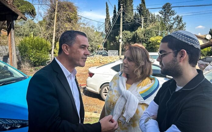Kiryat Shmona mayoral candidate Eli Zafrani (left) speaks with two residents of the city outside his campaign HQ on election day, February 18, 2025 (Shalom Yerushalmi/Times of Israel) Kiryat Shmona mayoral candidate Eli Zafrani (left) speaks with two residents of the city outside his campaign HQ on election day, February 18, 2025 (Shalom Yerushalmi/Times of Israel)