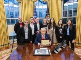 US President Donald Trump meets with a delegation of former hostages in the Oval Office, and shows off a plaque of gratitude from Hostage Families Forum, March 5, 2025. (photo credit: SCREENSHOT/X/POTUS)