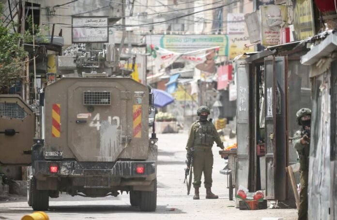 Troops were deployed to the area after an explosive device, suspected to be an IED, severely injured an IDF reserve soldier on Wednesday. The soldier, a member of Battalion 9221 from the Ephraim Brigade, was critically wounded in the explosion and was immediately transported to a nearby hospital for treatment