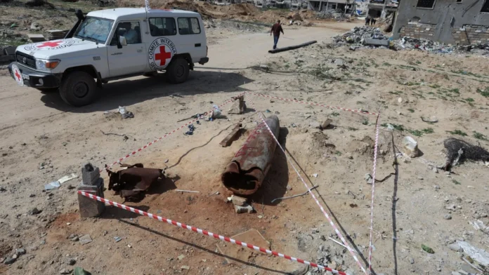 Red Cross vehicle in Gaza amid ongoing conflict and humanitarian rescue operations