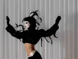 Barbie Cute in “Take Off” explores identity through drag and dance in a bold, expressive solo by Hani Sirkis