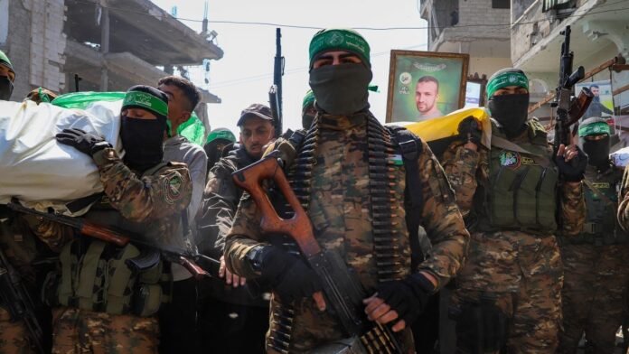 A Hamas flag painted on a cracked wall symbolizes the group’s enduring influence amid escalating Gaza tensions and hostage negotiations A Hamas flag painted on a cracked wall symbolizes the group’s enduring influence amid escalating Gaza tensions and hostage negotiations
