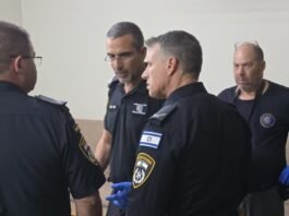 Israel Police investigate the scene following a violent attempted kidnapping incident in Hod Hasharon