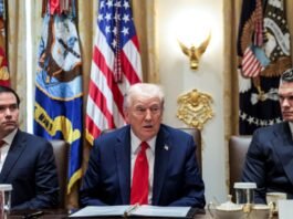 Protesters wave flags and hold hostage cutouts near the US consulate as Trump meets Netanyahu over Gaza ceasefire