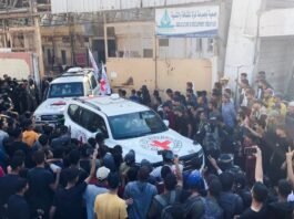 Israeli military personnel prepare for the arrival of released hostages outside Sheba Medical Center in Ramat Gan