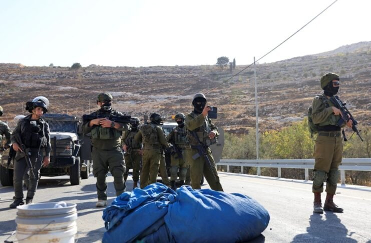 IDF soldiers patrol the West Bank on October 17, 2025, following intensified security measures post-October 7 attacks