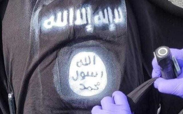 Police released an image showing an ISIS symbol on a suspect’s shirt during a related 2024 checkpoint attack Police released an image showing an ISIS symbol on a suspect’s shirt during a related 2024 checkpoint attack