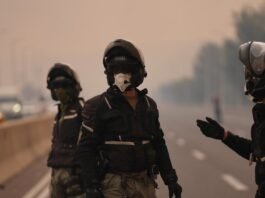 Ashkelon Apartment Fire Injures Eleven as Storm Flood Risks Rise Firefighters and medics operate outside a residential building in Ashkelon following an apartment fire amid severe storm conditions