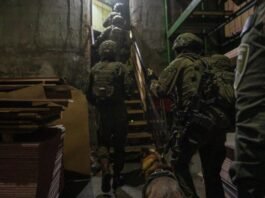 Israeli police officers participate in a coordinated nationwide raid targeting illegal weapons, drugs and organized crime networks