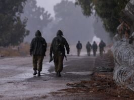IDF Imposes Nationwide Curfew as Storm Byron Threatens Severe Disruption Givati Shaked brigade soldiers train in heavy rain during severe weather conditions near Moshav Jonathan in the Golan Heights