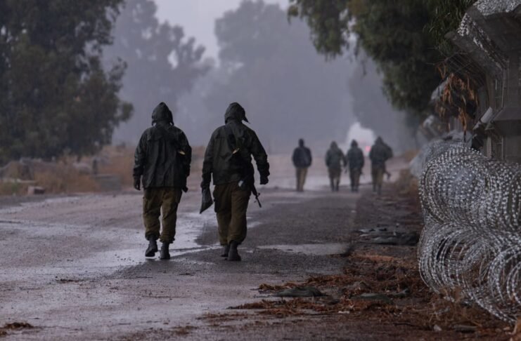 Givati Shaked brigade soldiers train in heavy rain during severe weather conditions near Moshav Jonathan in the Golan Heights