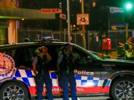 A man reacts near Bondi Beach after a deadly shooting at a Hanukkah celebration in Sydney, Australia, on December fourteenth