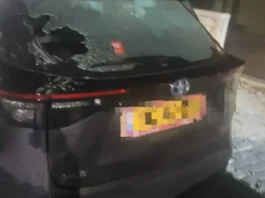 Damaged vehicles in Givaot Bar after masked men breached the security fence during a late-night attack