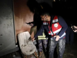 Emergency responders inspect damaged buildings and debris following Iranian missile strikes, as tensions escalate across Israel and neighboring regions amid ongoing conflict